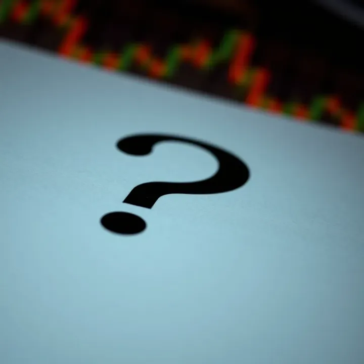 Close-up of a question mark symbol highlighting punctuation usage in written English